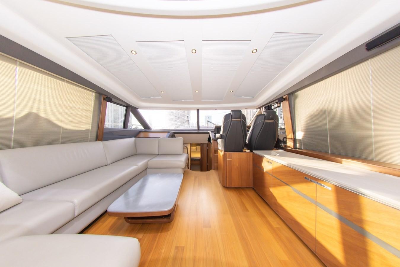 a living room with a large window aboard V65 PRINCESS Yacht for Sale