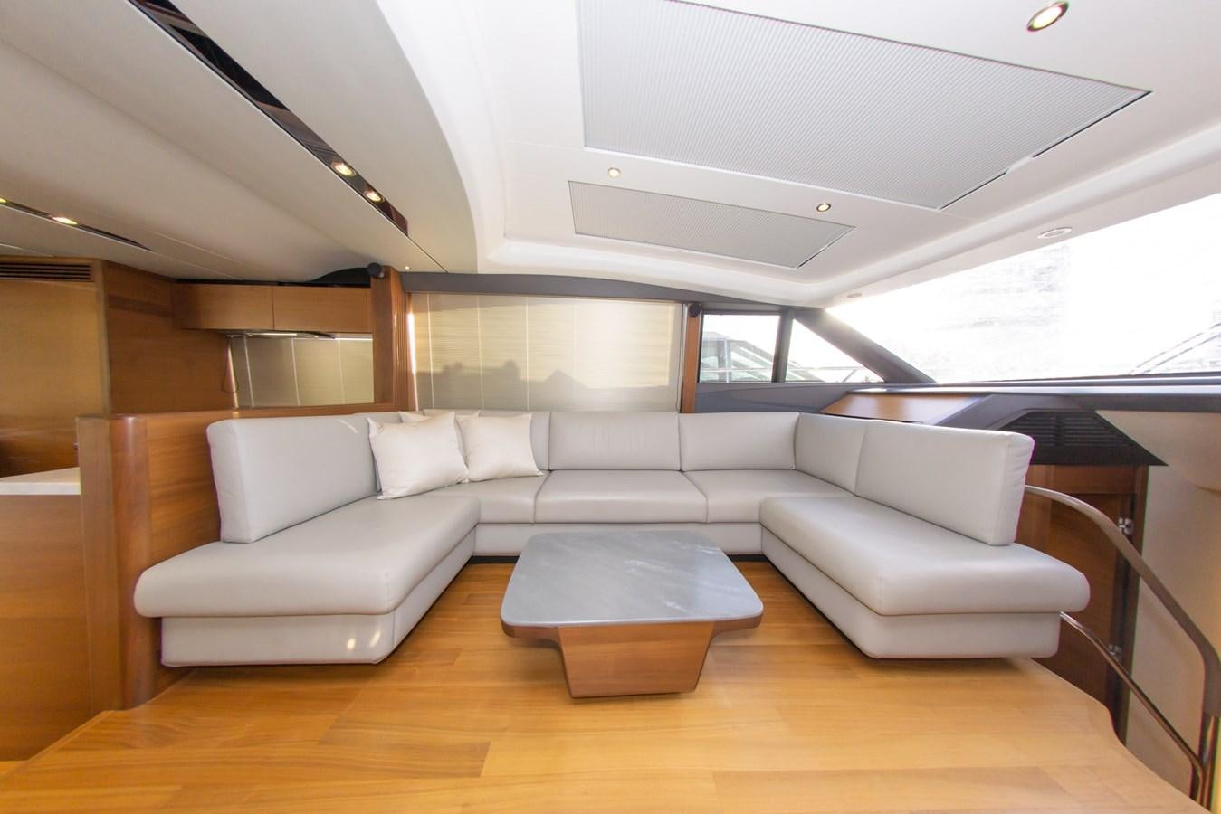 a room with couches and a table aboard V65 PRINCESS Yacht for Sale