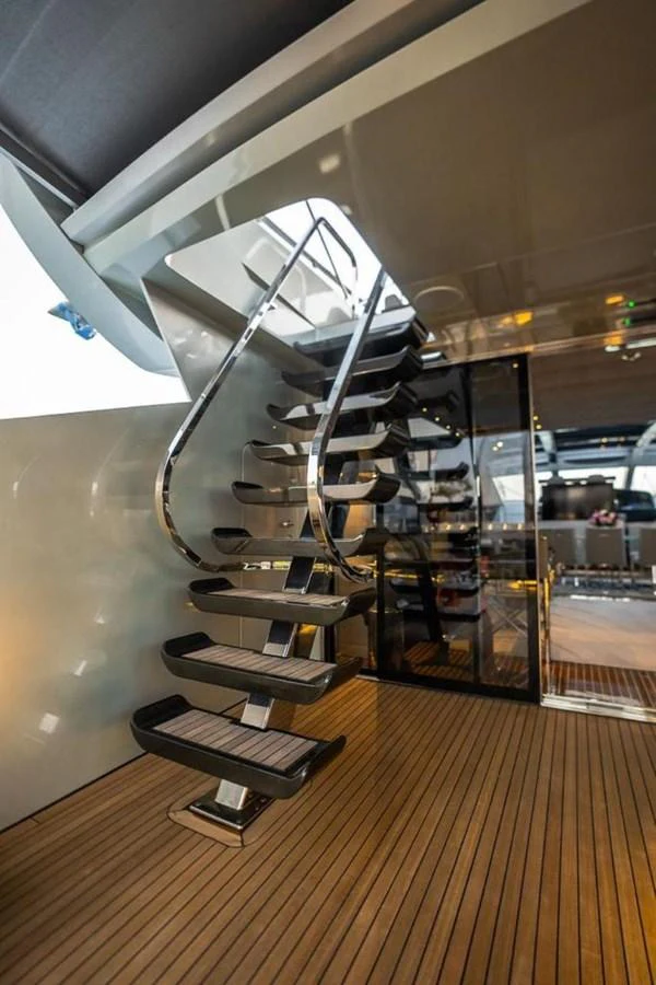 a metal spiral staircase in a building aboard HIGH ROLLER Yacht for Sale