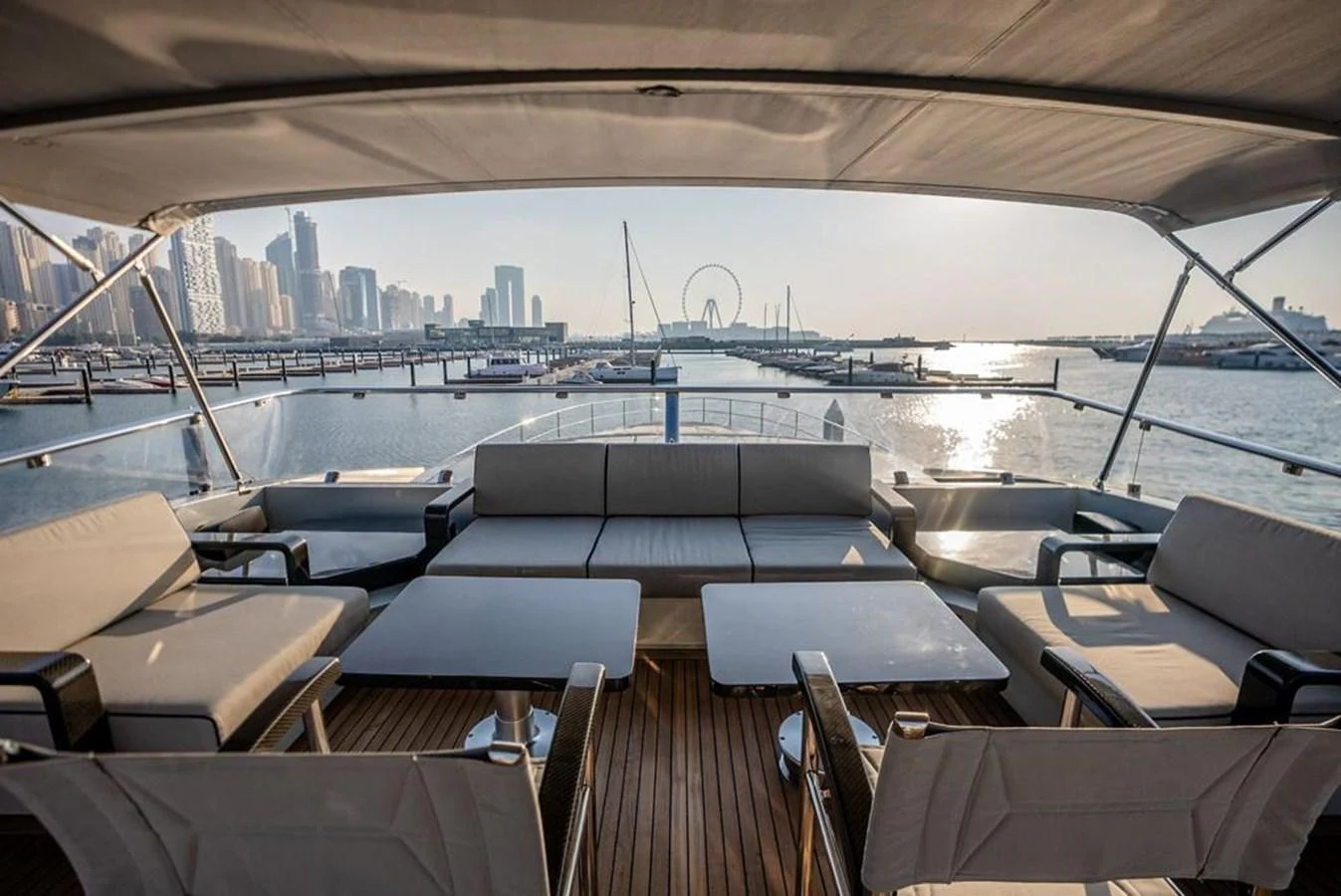 a deck with a view of a city and a body of water aboard HIGH ROLLER Yacht for Sale