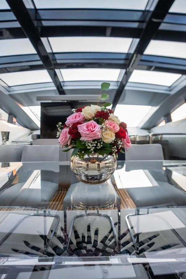 a vase with flowers in it aboard HIGH ROLLER Yacht for Sale