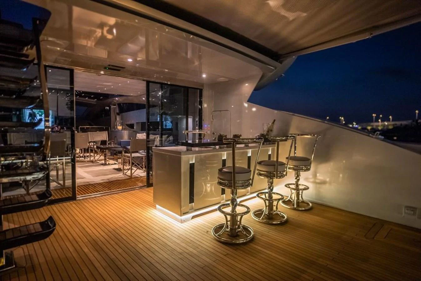 a room with tables and chairs aboard HIGH ROLLER Yacht for Sale