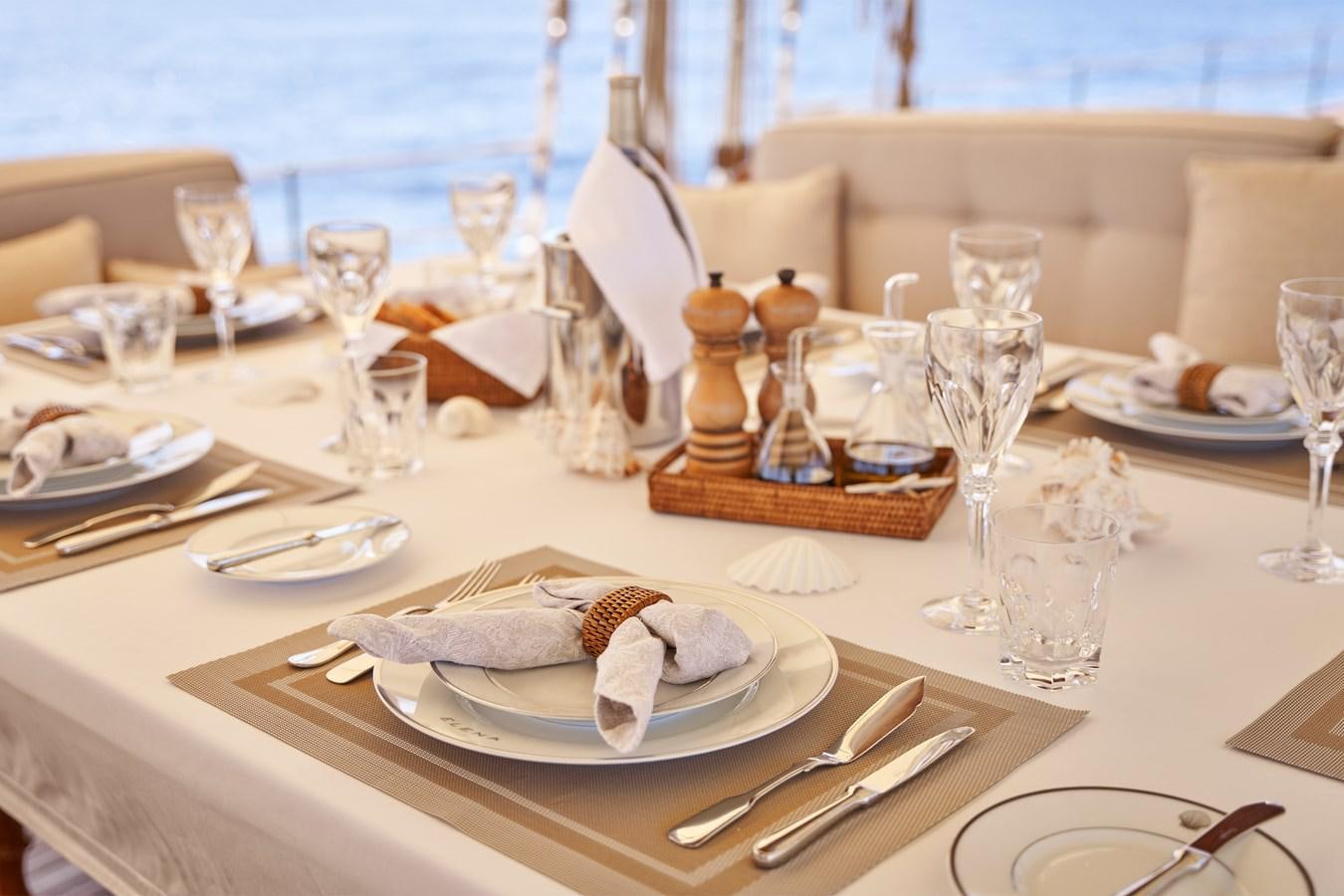 a table with place settings aboard ELENA OF LONDON Yacht for Sale