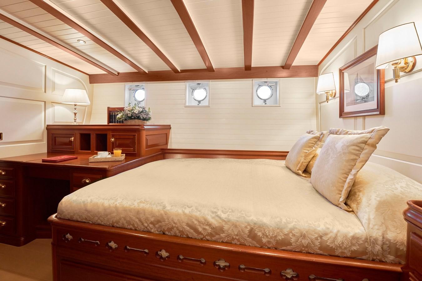 a large bed with a large bed aboard ELENA OF LONDON Yacht for Sale