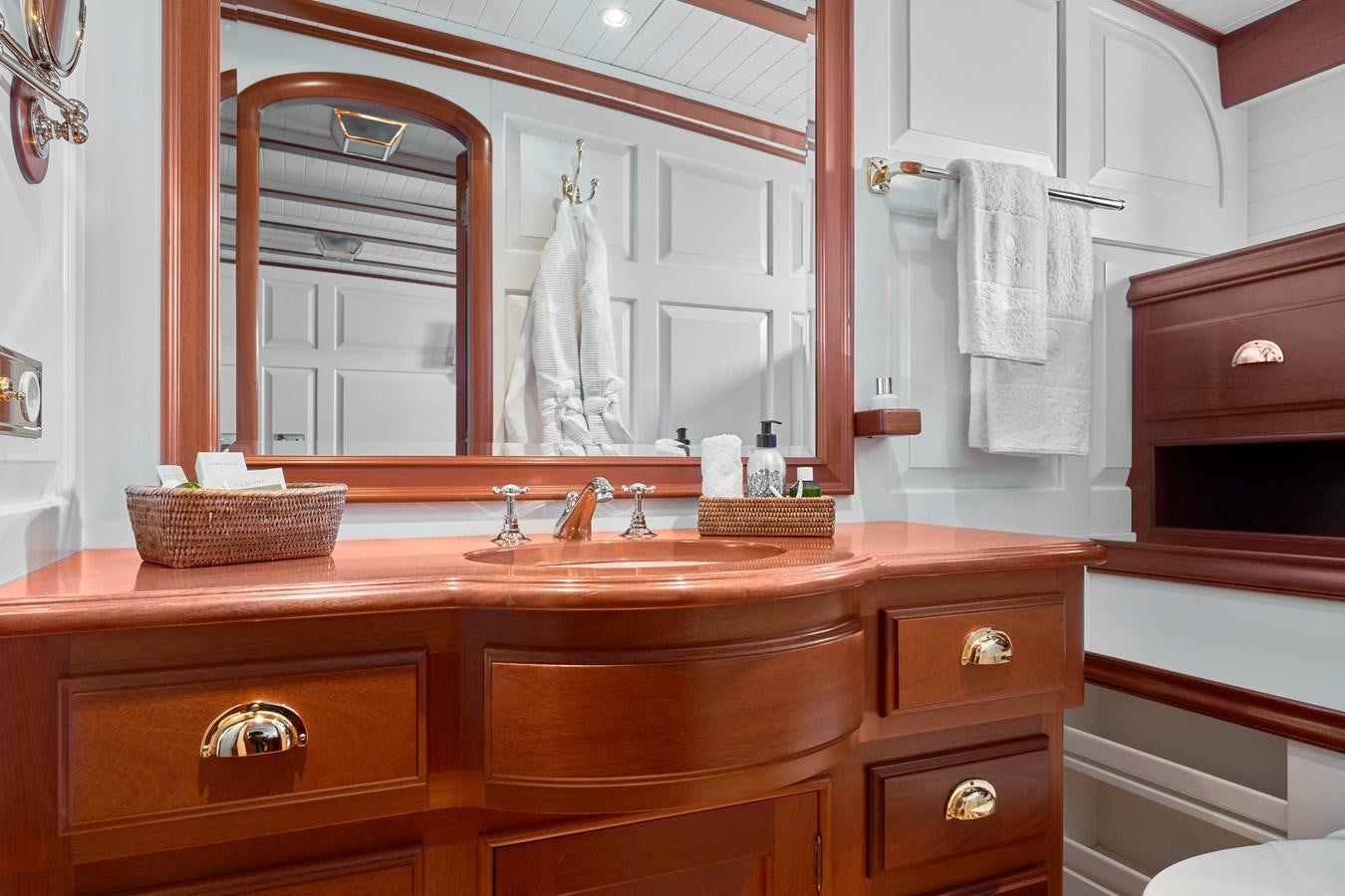a bathroom with a large mirror aboard ELENA OF LONDON Yacht for Sale