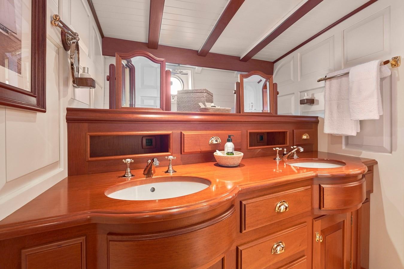 a bathroom with a sink and a mirror aboard ELENA OF LONDON Yacht for Sale