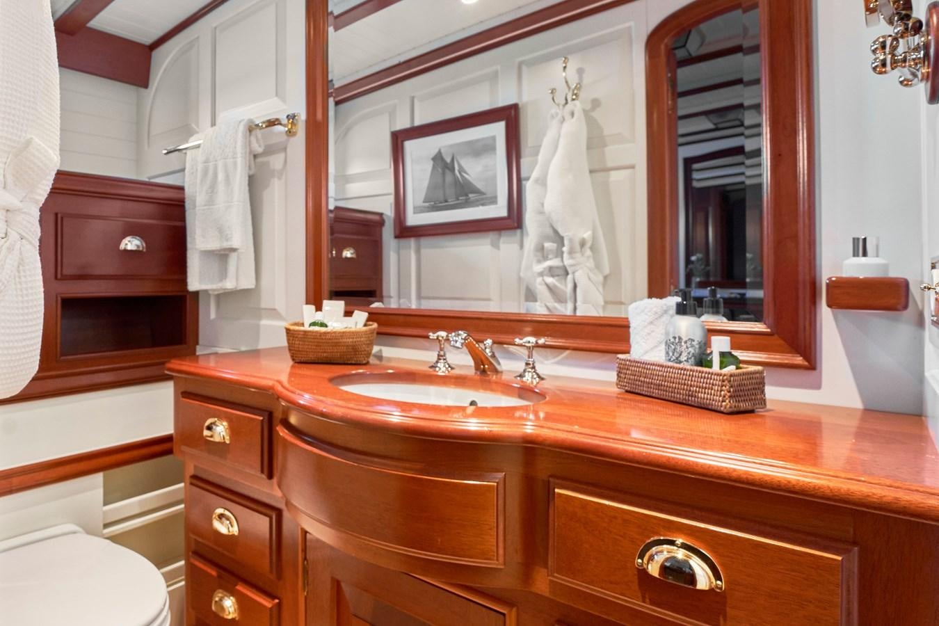 a bathroom with a large mirror aboard ELENA OF LONDON Yacht for Sale
