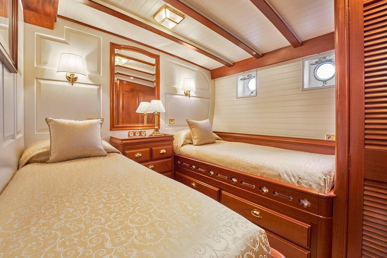 a couple of beds in a hotel room aboard ELENA OF LONDON Yacht for Sale