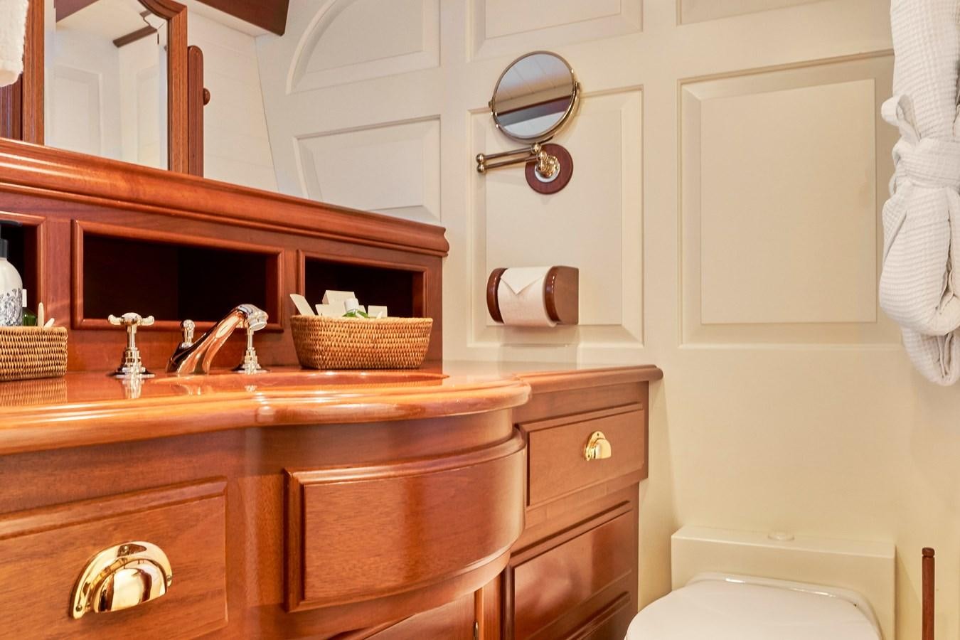 a bathroom with a mirror and a sink aboard ELENA OF LONDON Yacht for Sale