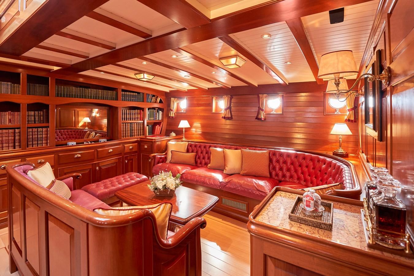 a living room with a wood ceiling aboard ELENA OF LONDON Yacht for Sale