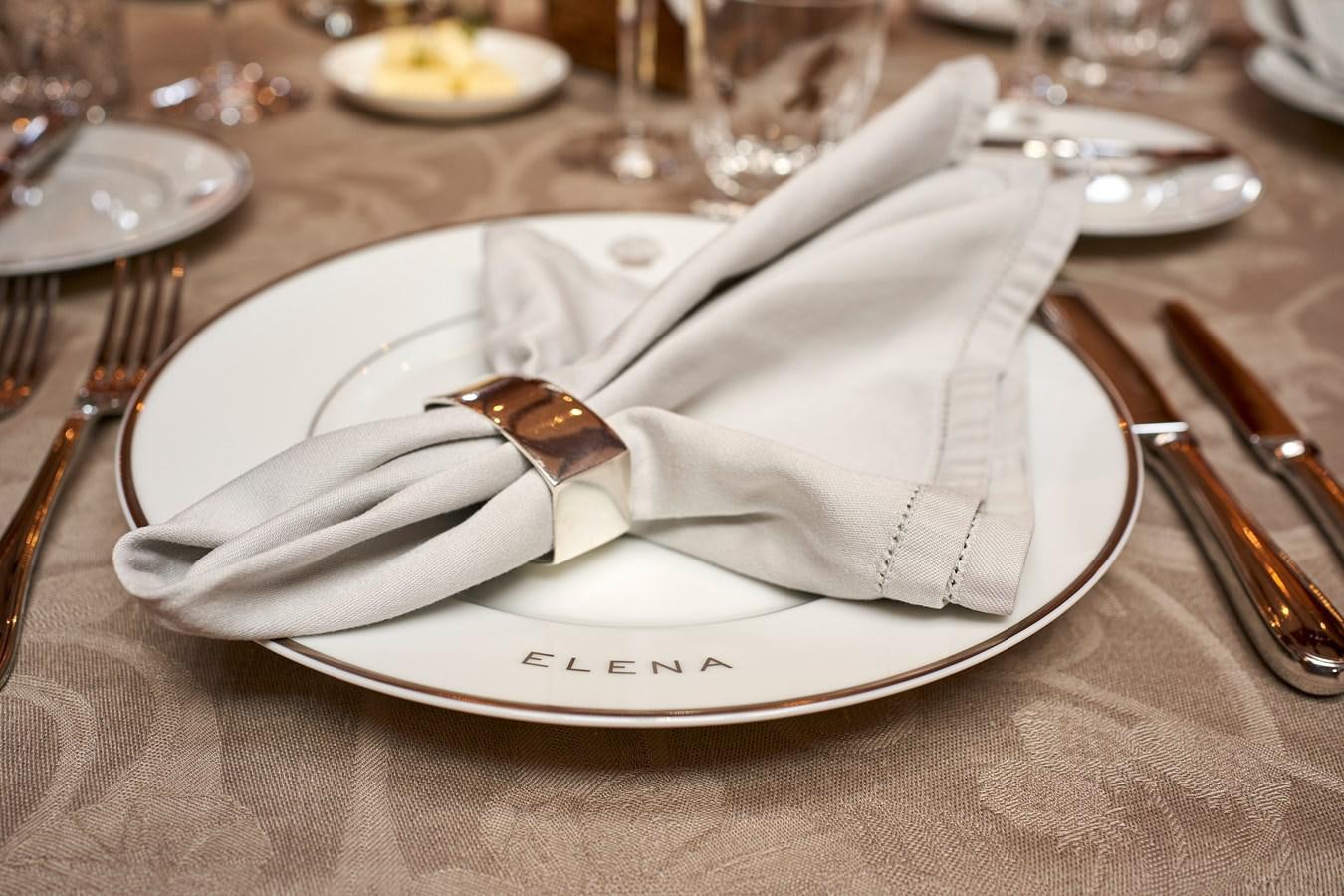 a napkin on a plate aboard ELENA OF LONDON Yacht for Sale