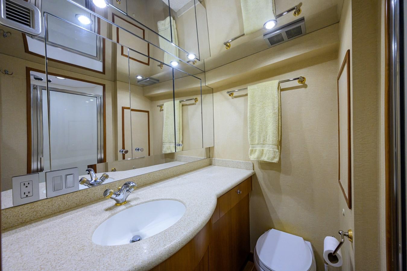 a bathroom with a sink and toilet aboard SAR Yacht for Sale