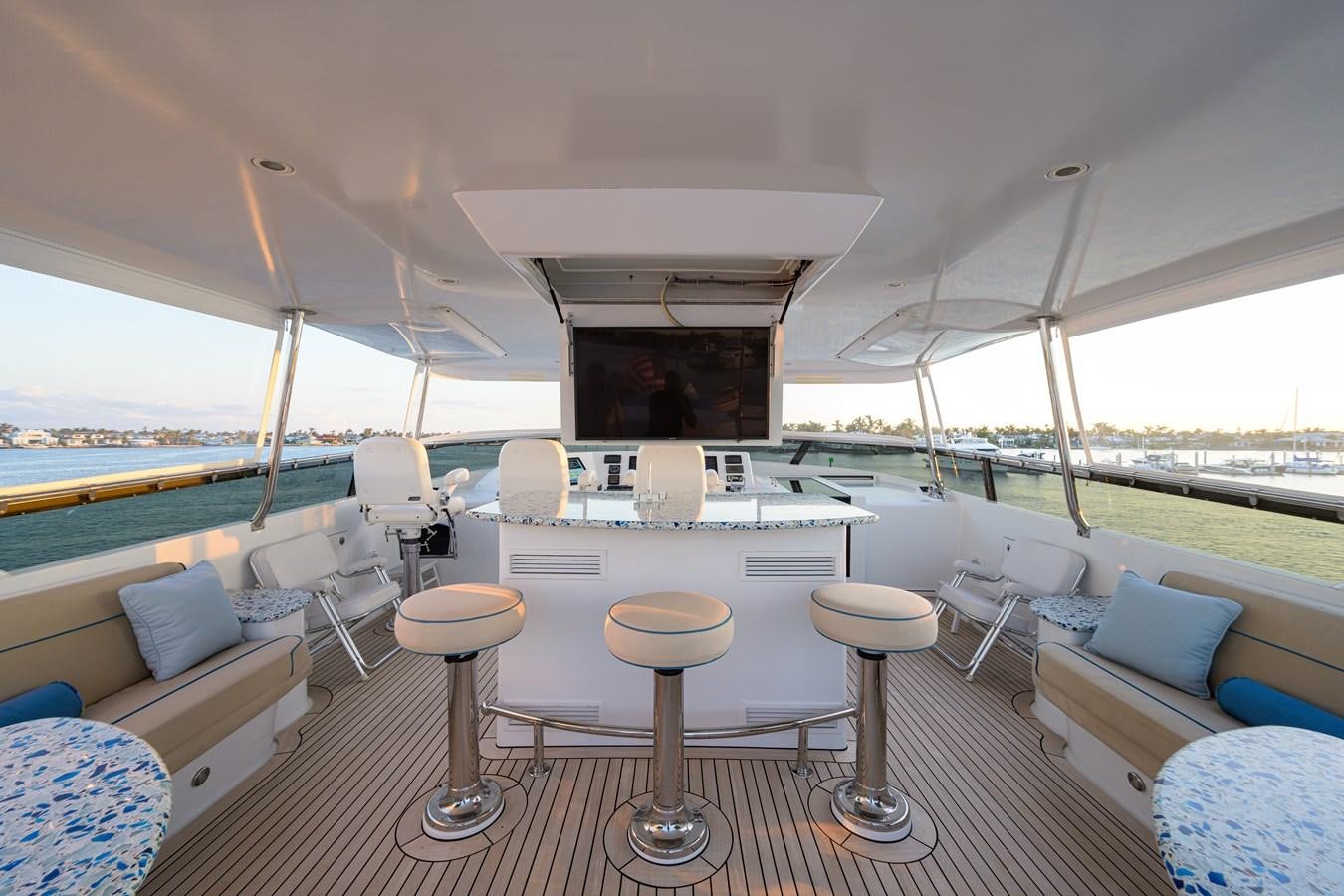 a boat with stools and tables aboard SAR Yacht for Sale