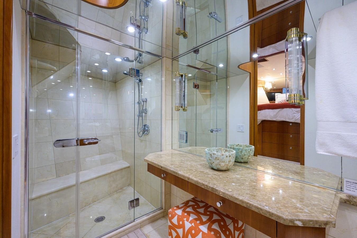 a bathroom with a glass shower aboard SAR Yacht for Sale
