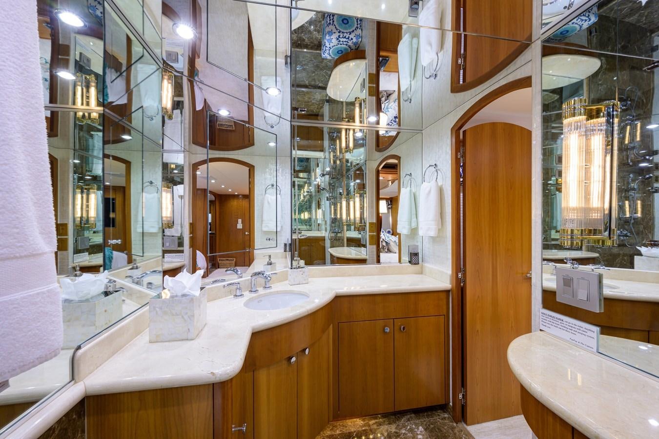 a bathroom with a large mirror aboard SAR Yacht for Sale
