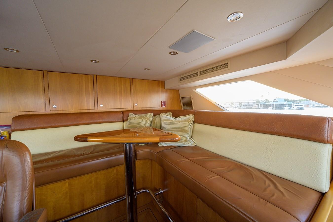 a room with wooden furniture aboard SAR Yacht for Sale