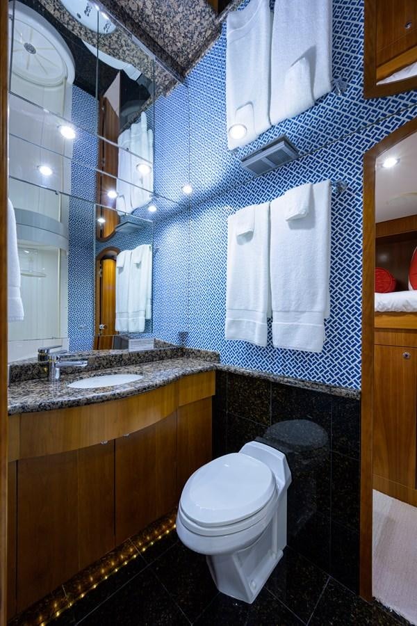 a bathroom with a toilet and a sink aboard SAR Yacht for Sale