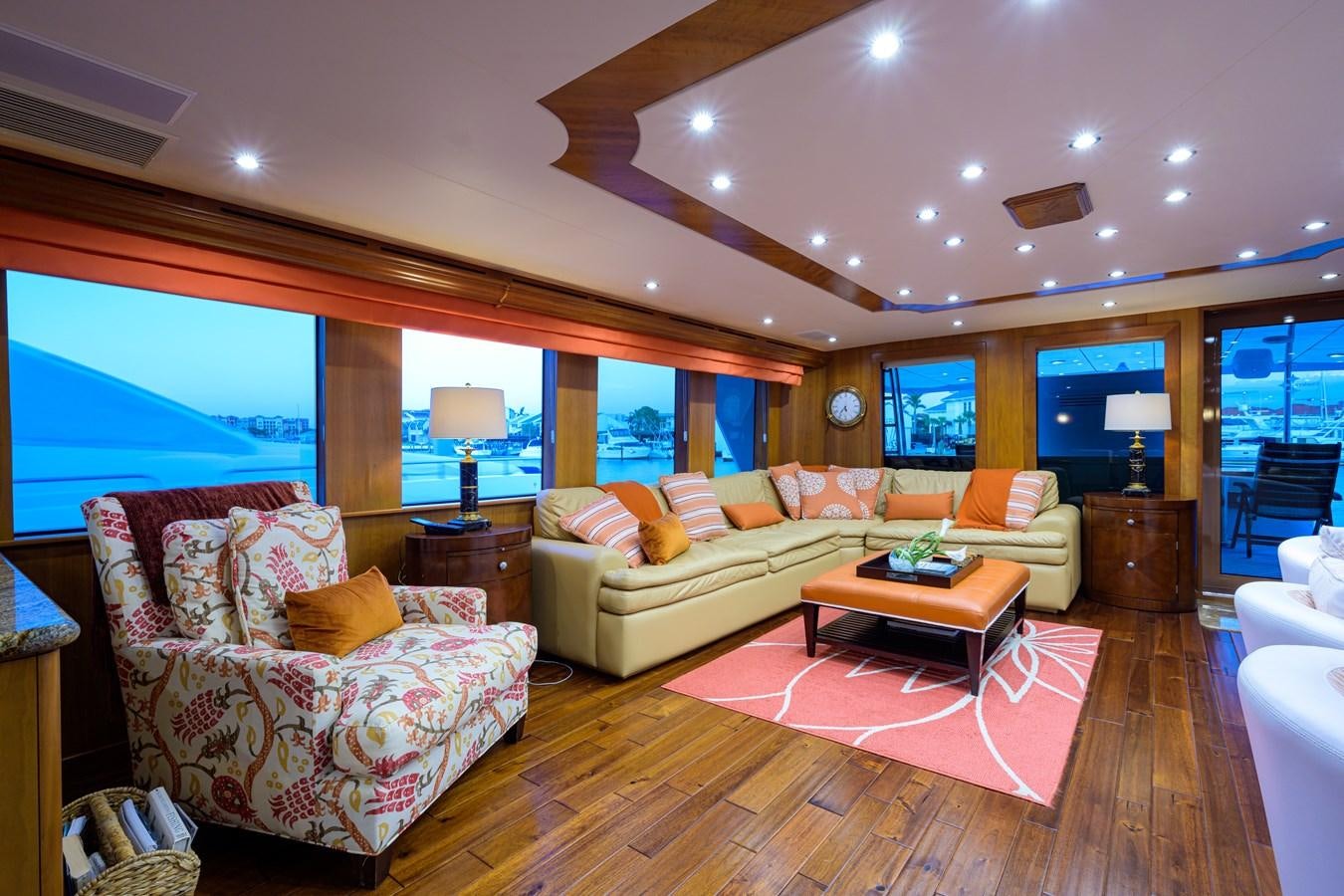 a living room with a large window aboard SAR Yacht for Sale