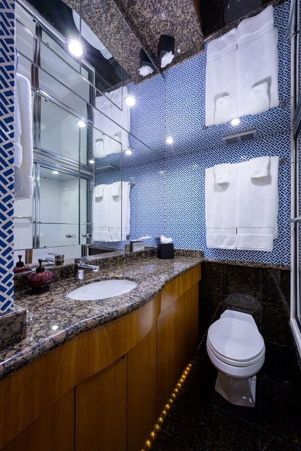 a bathroom with a toilet and a sink aboard SAR Yacht for Sale