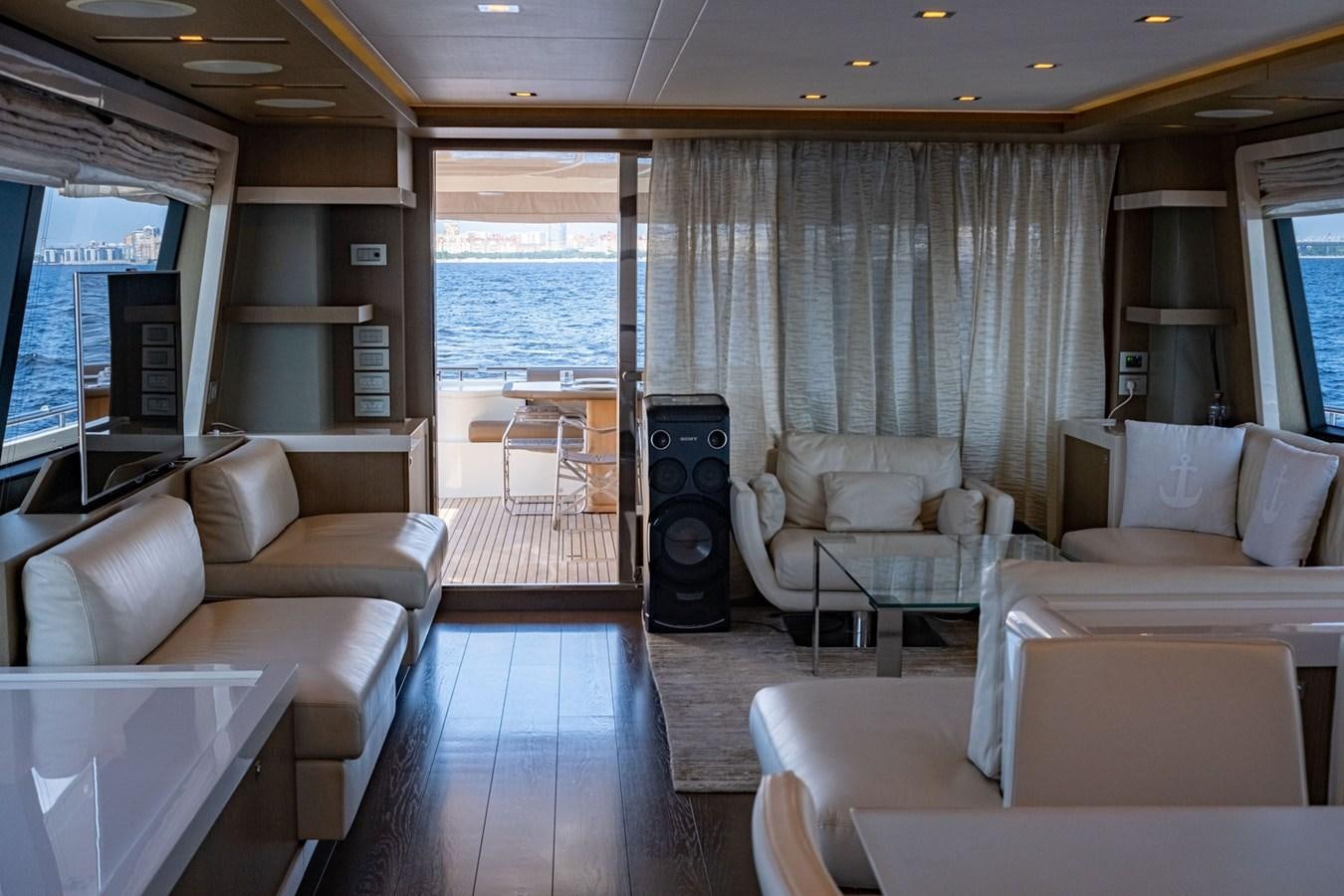a living room with a large window aboard FERRETTI 870 Yacht for Sale
