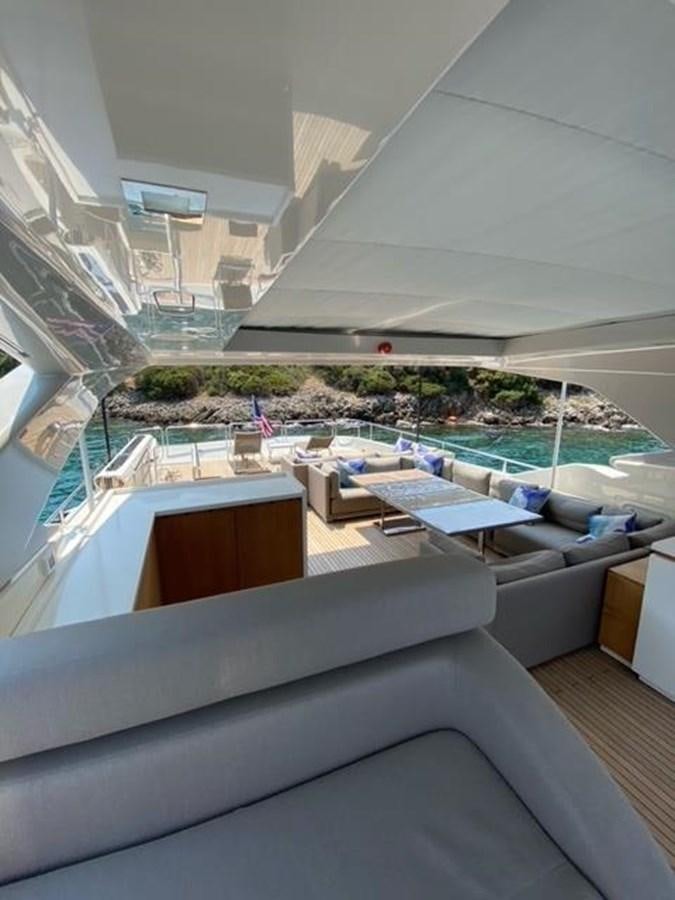 a room with a pool and a deck aboard SELF Yacht for Sale