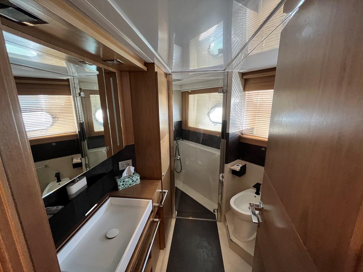 a bathroom with a large mirror aboard SELF Yacht for Sale