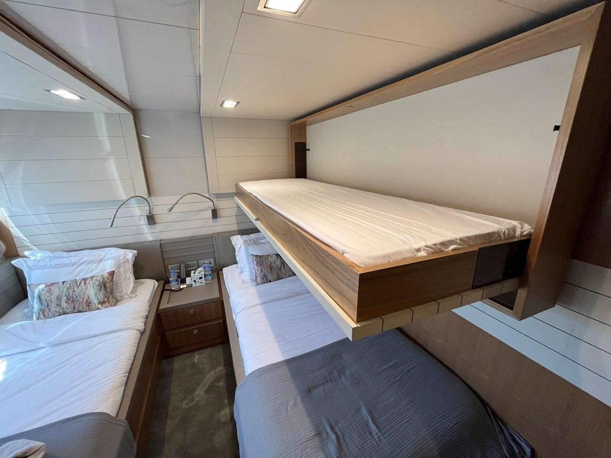 a room with bunk beds aboard SELF Yacht for Sale