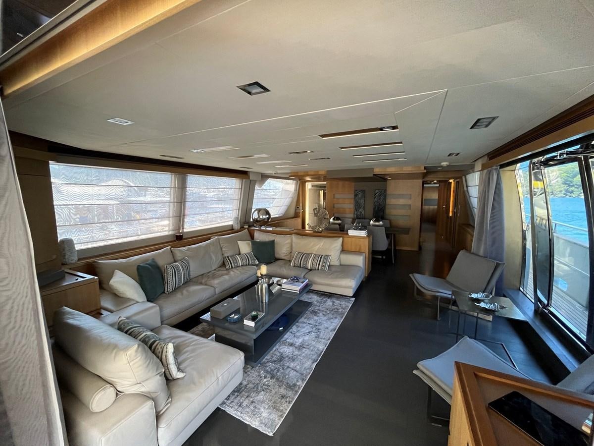 a living room with a large window aboard SELF Yacht for Sale