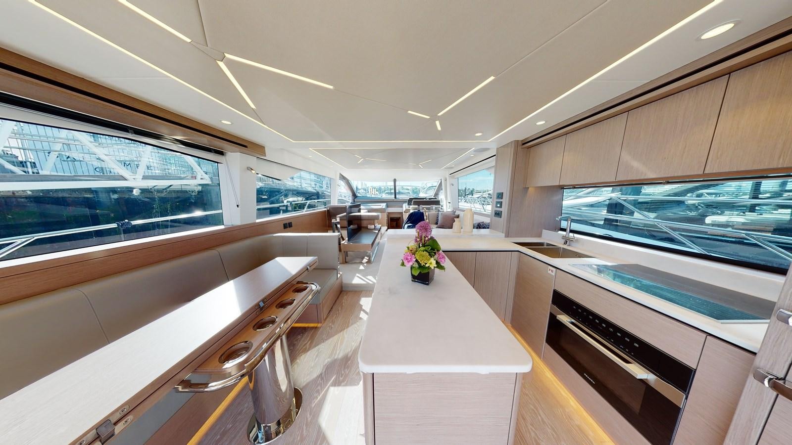 a room with a table and chairs aboard RANI Yacht for Sale