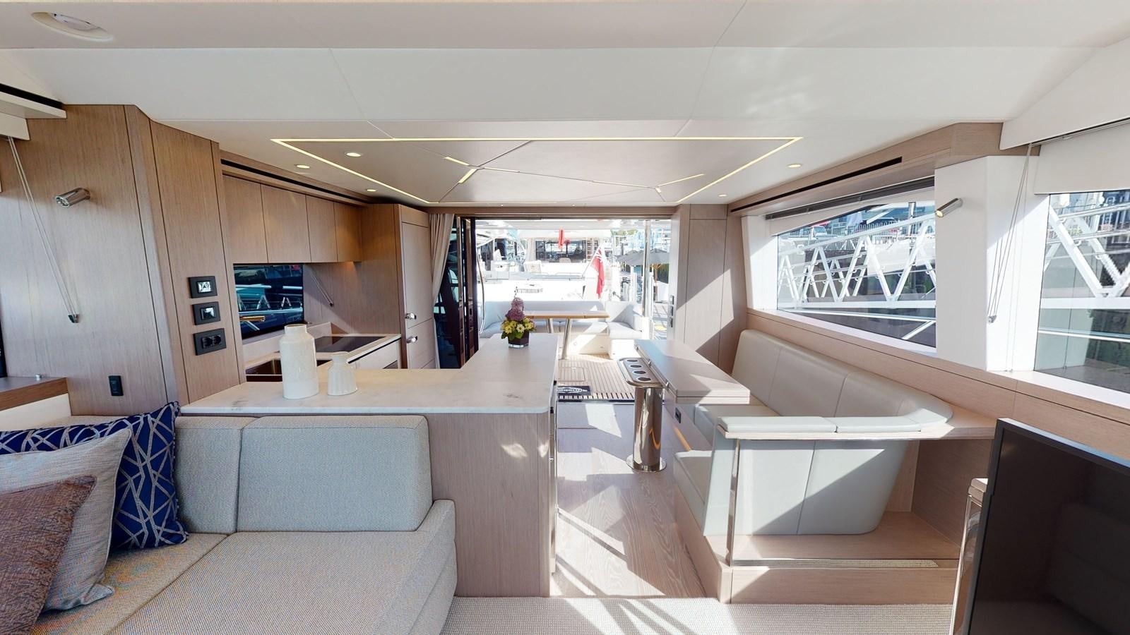 a room with a couch and a table aboard RANI Yacht for Sale