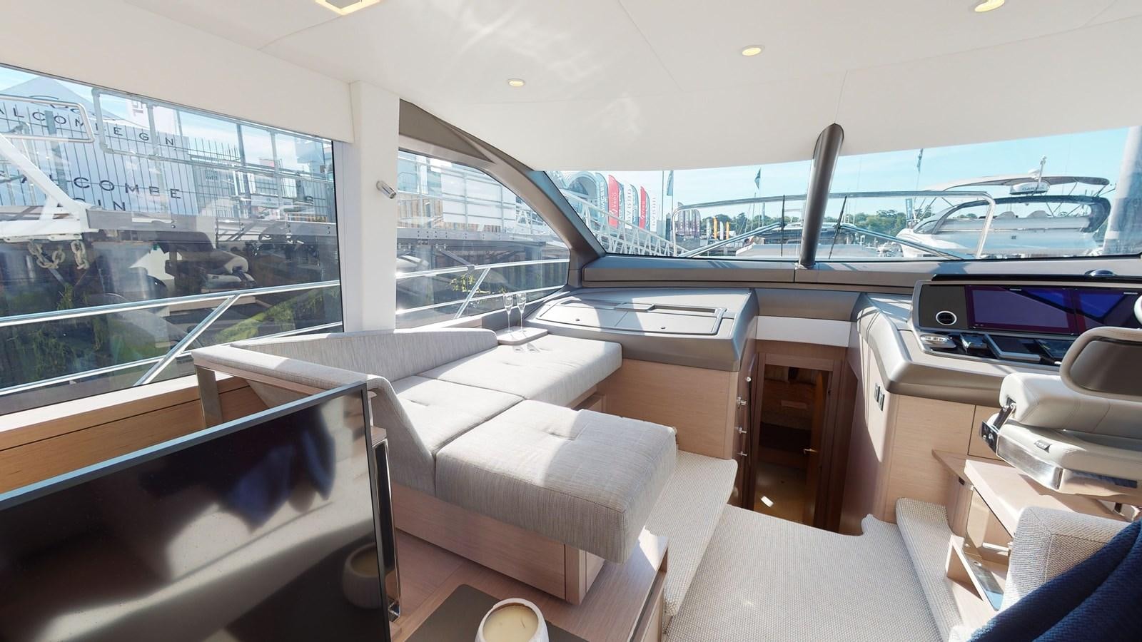 inside of a room with a view of the city and the water aboard RANI Yacht for Sale