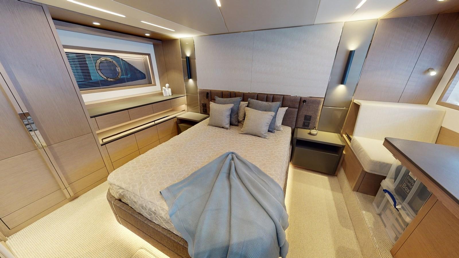 a room with a bed and a desk aboard RANI Yacht for Sale