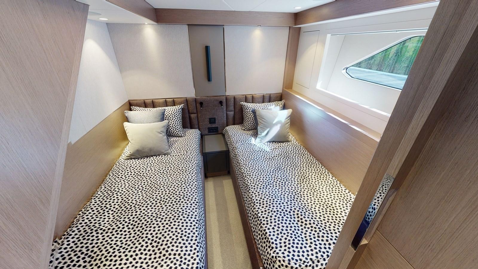 a bed and a window in a room aboard RANI Yacht for Sale