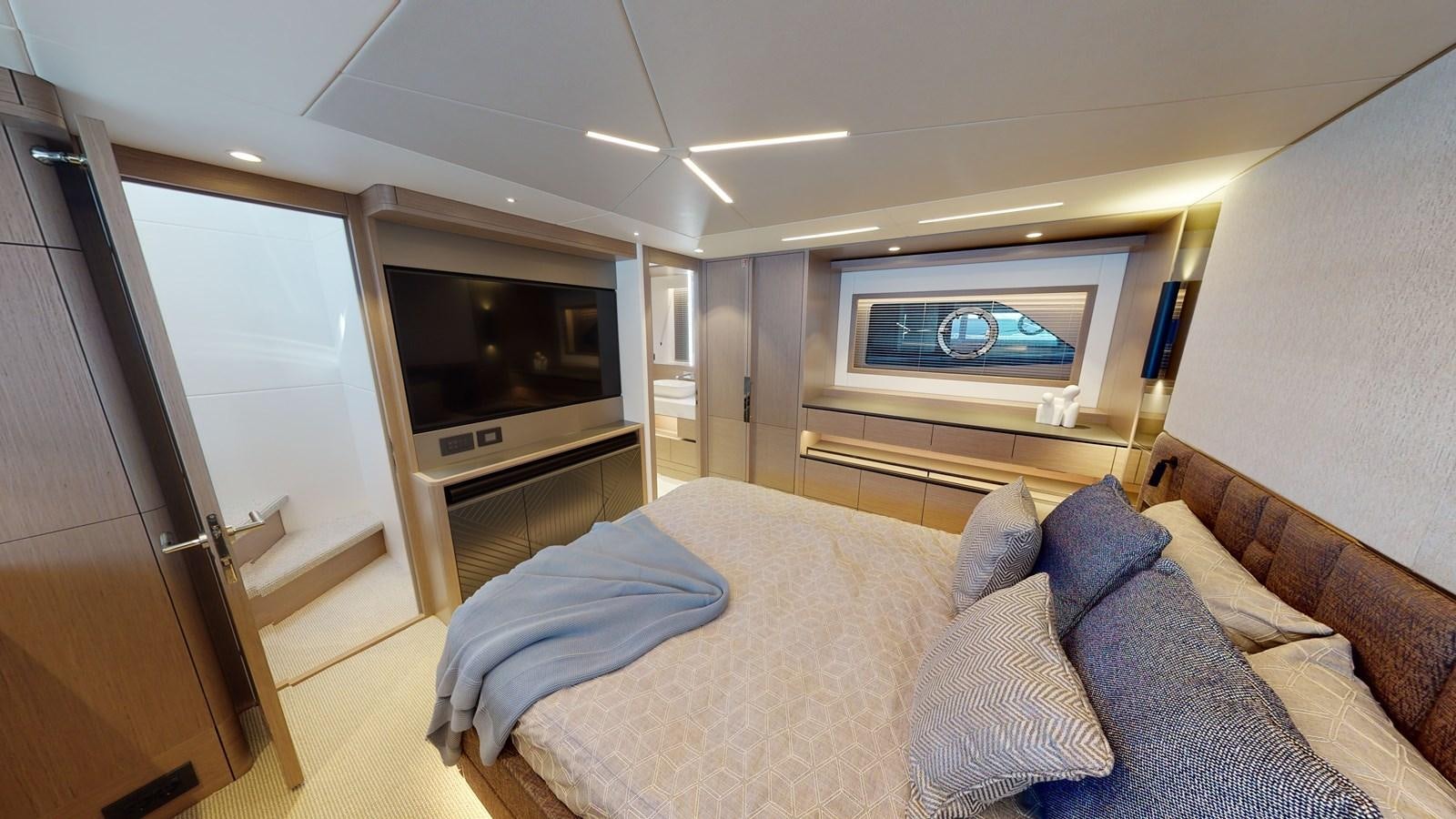 a bedroom with a bed and a television aboard RANI Yacht for Sale