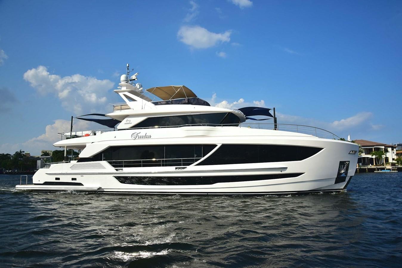 a white yacht on the water aboard FREEDOM Yacht for Sale