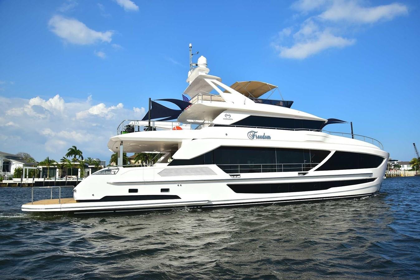 a white yacht on the water aboard FREEDOM Yacht for Sale