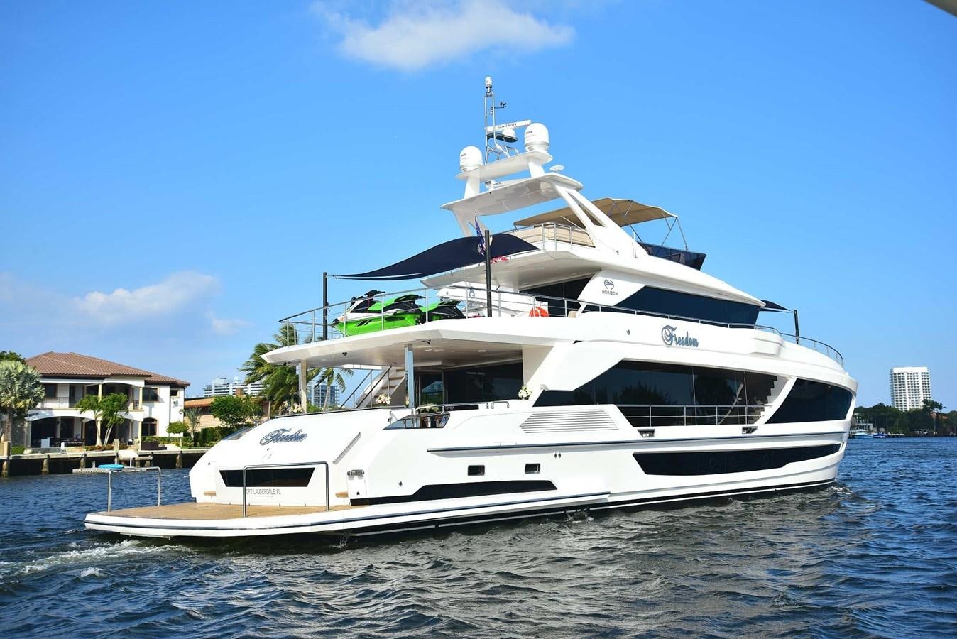 a white yacht on the water aboard FREEDOM Yacht for Sale