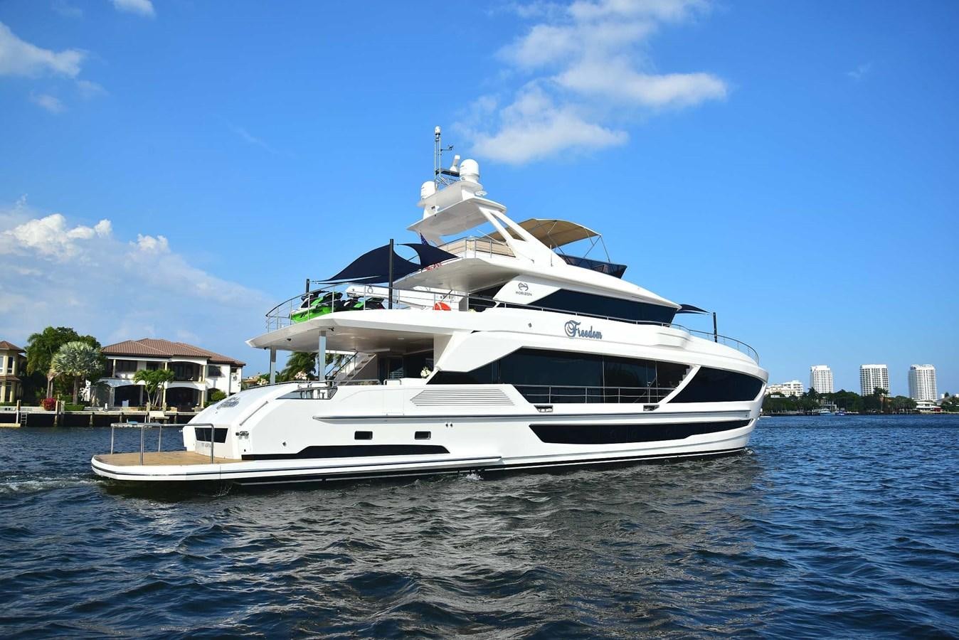 a white yacht on the water aboard FREEDOM Yacht for Sale