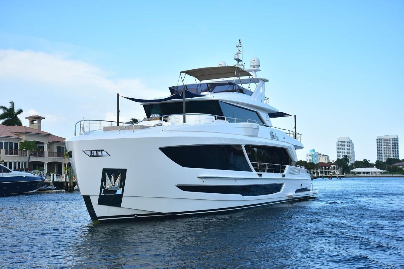 a white boat on the water aboard FREEDOM Yacht for Sale
