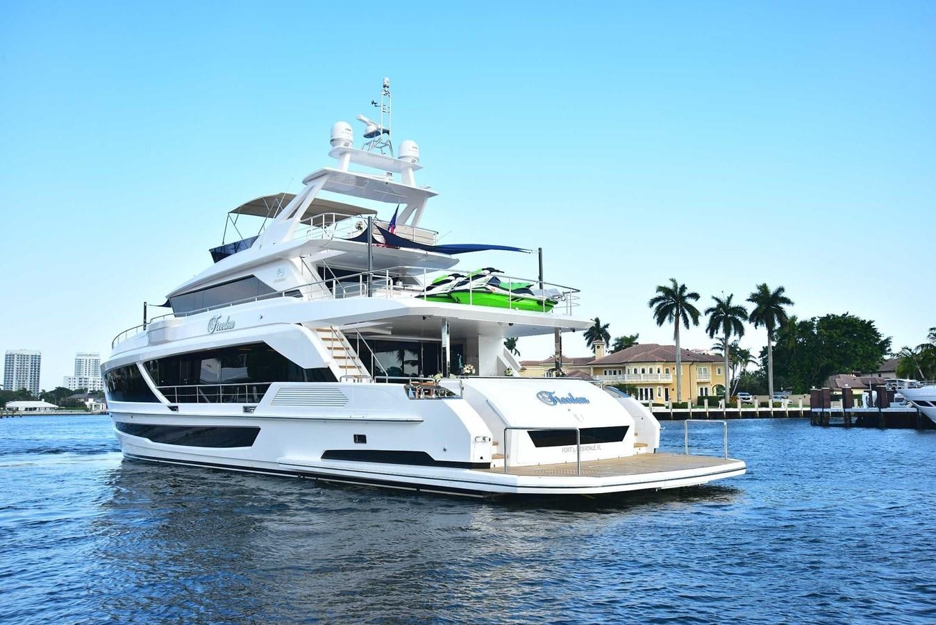 a white boat on the water aboard FREEDOM Yacht for Sale