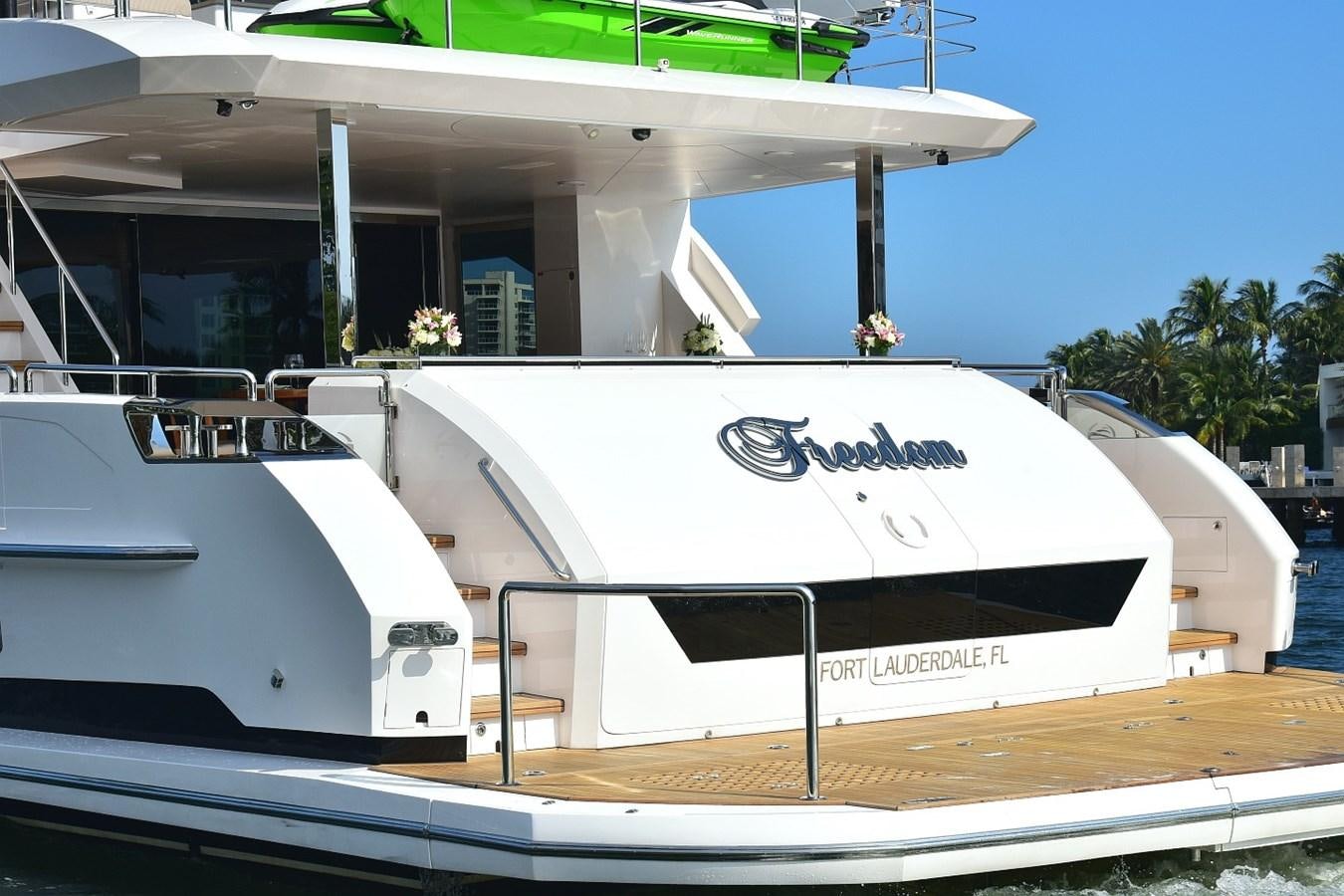 a boat docked at a pier aboard FREEDOM Yacht for Sale
