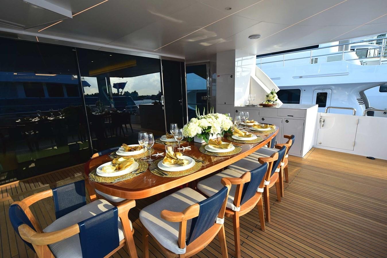 a large kitchen with a dining table aboard FREEDOM Yacht for Sale