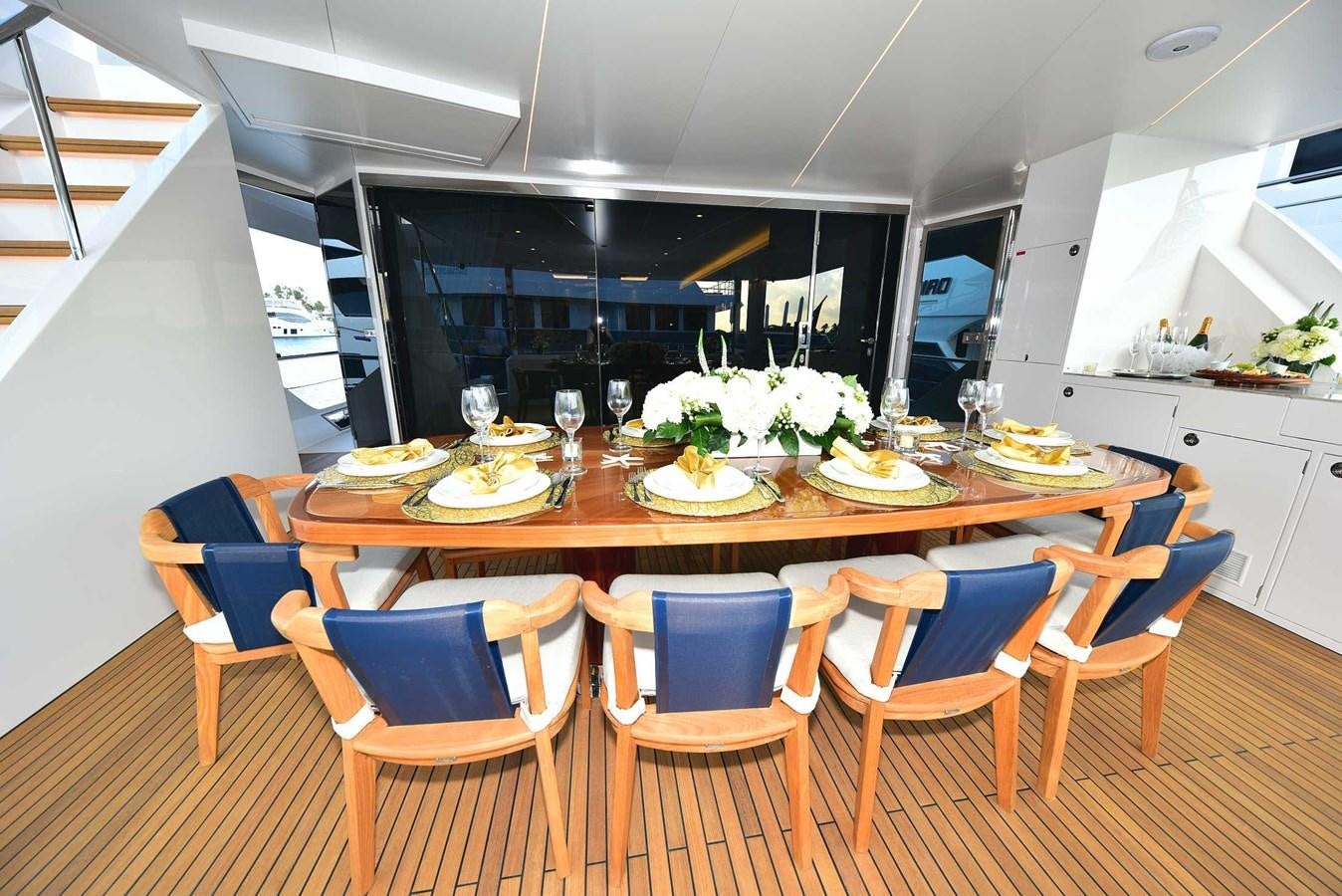 a dining table set for a meal aboard FREEDOM Yacht for Sale