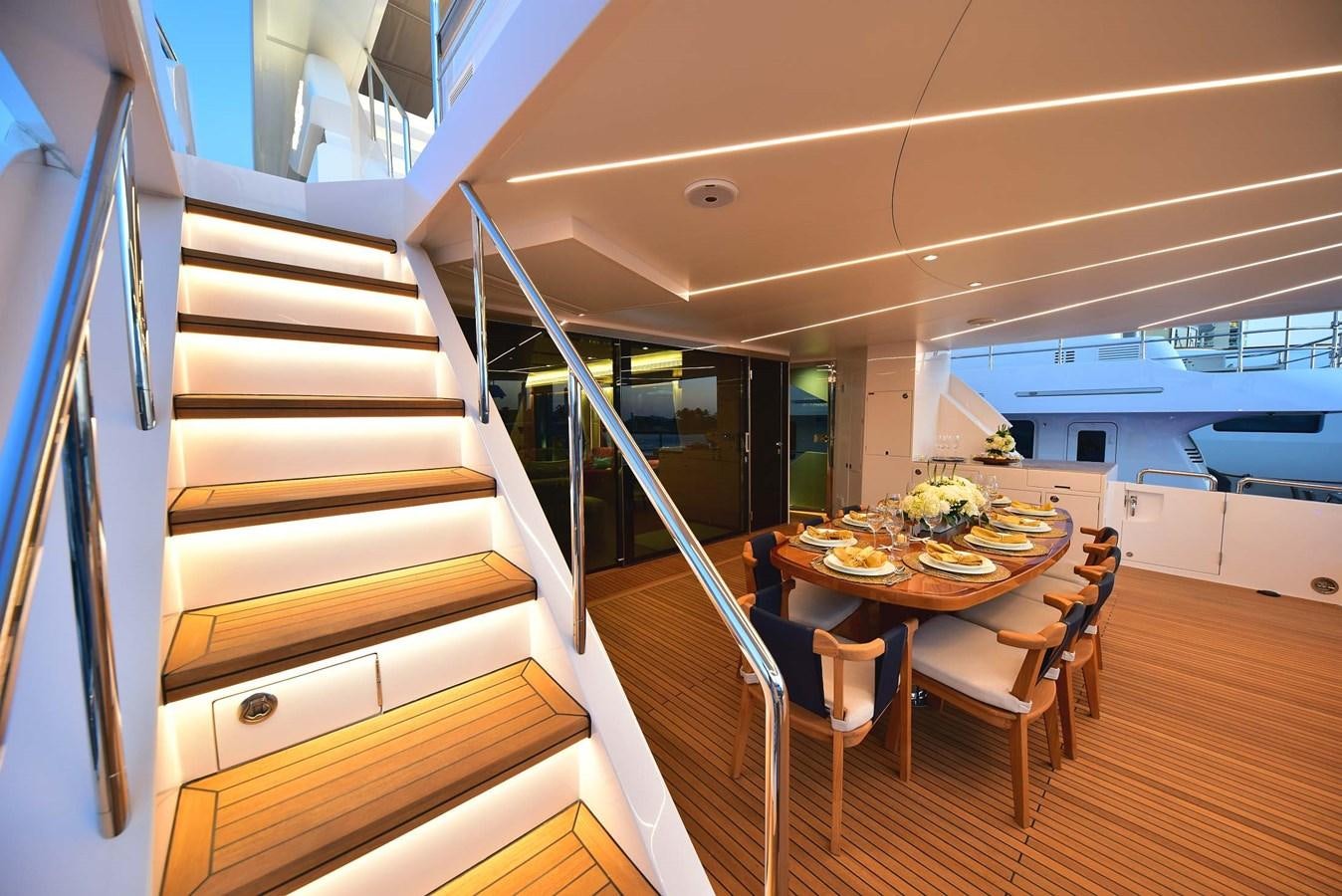 a kitchen with a table and chairs aboard FREEDOM Yacht for Sale