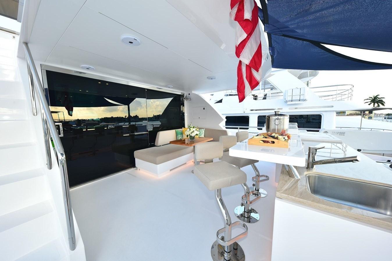 a room with a desk and chairs aboard FREEDOM Yacht for Sale
