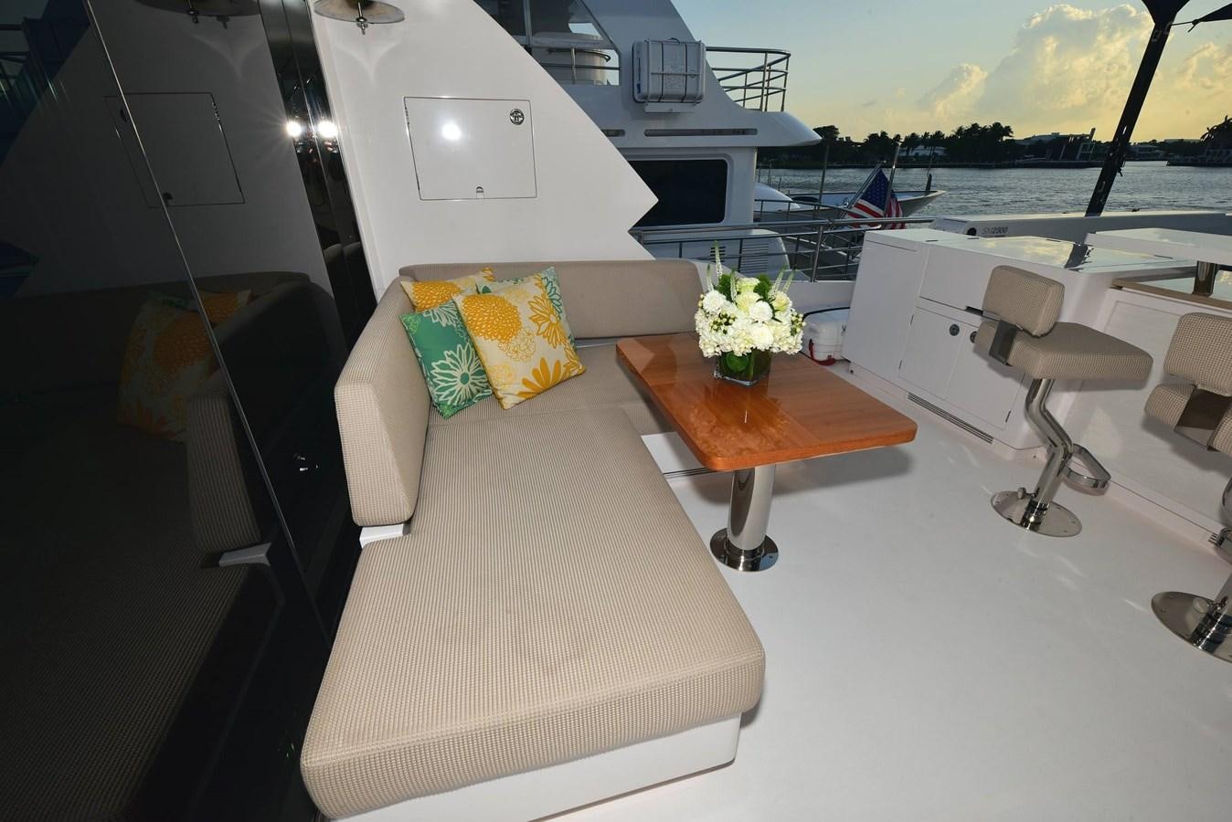 a room with a couch and a table with chairs on it aboard FREEDOM Yacht for Sale