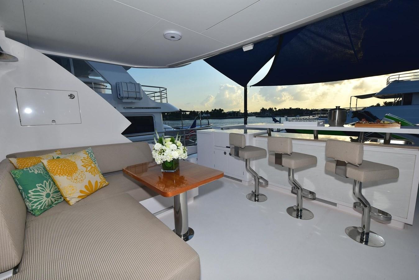 a room with a table and chairs aboard FREEDOM Yacht for Sale