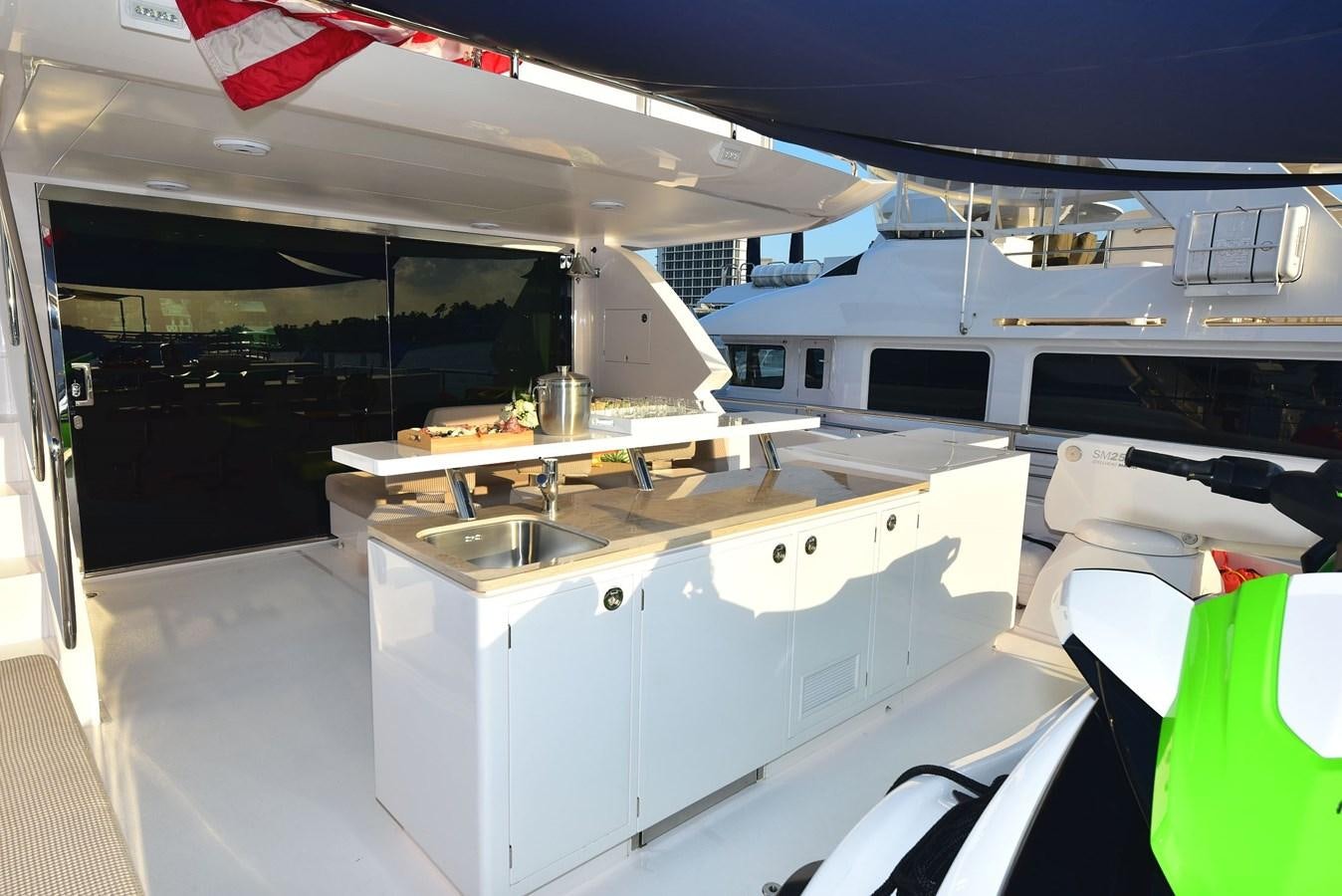 a kitchen with white cabinets aboard FREEDOM Yacht for Sale