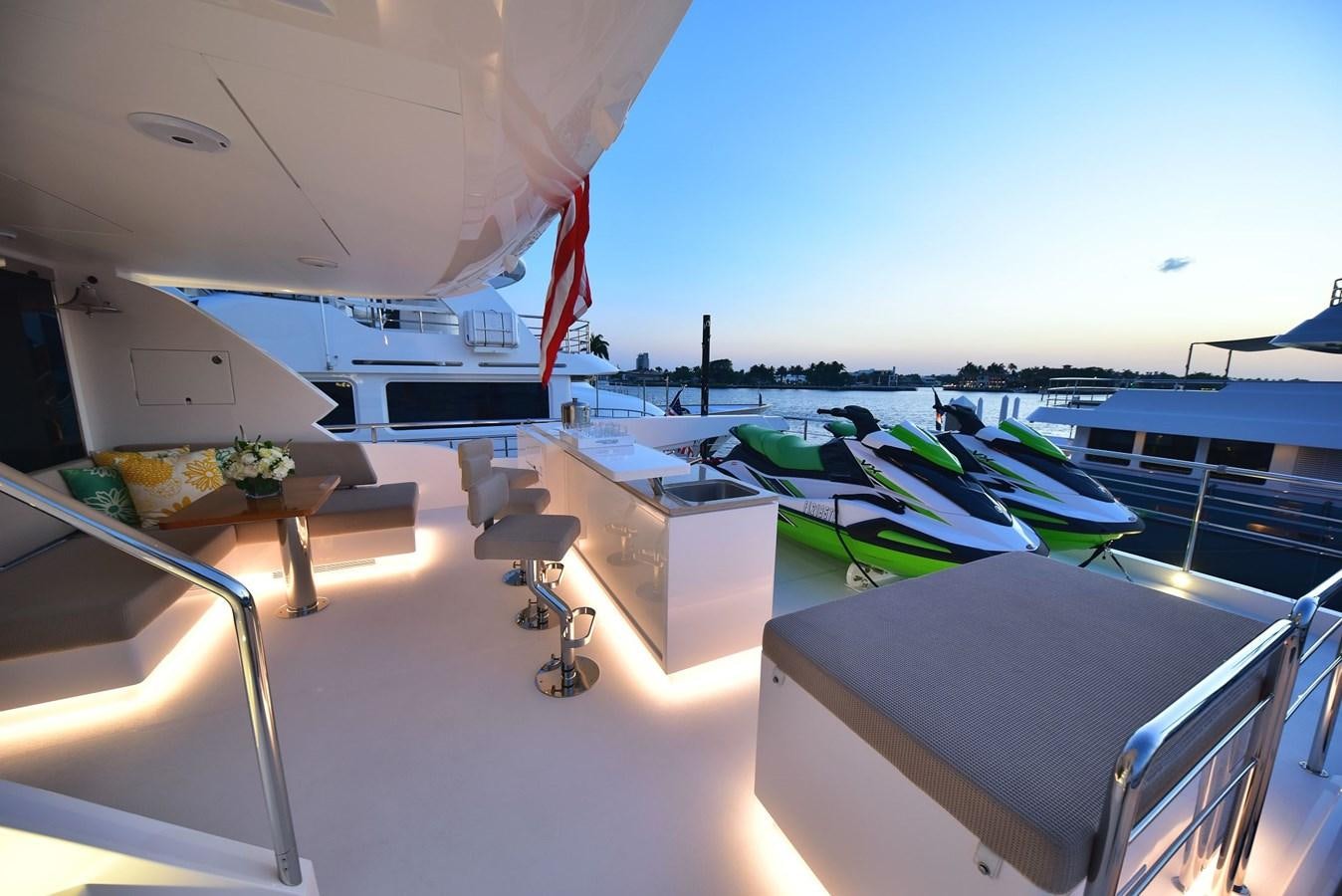 a room with a deck and a view of the water aboard FREEDOM Yacht for Sale