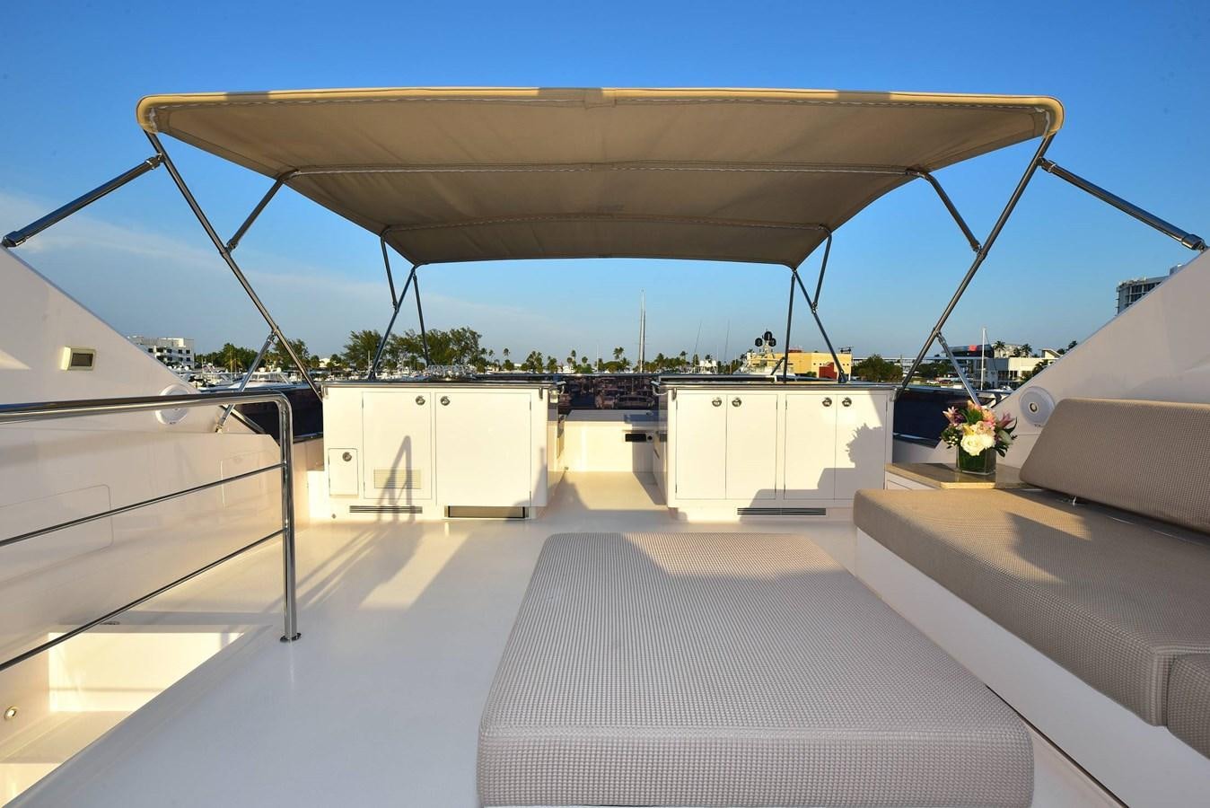 a room with a large white table and chairs and a large window aboard FREEDOM Yacht for Sale